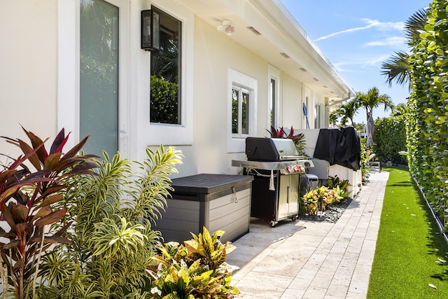 view of patio featuring a grill