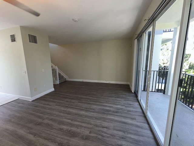 spare room featuring dark hardwood / wood-style flooring