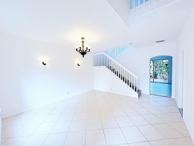 interior space featuring tile patterned floors and an inviting chandelier