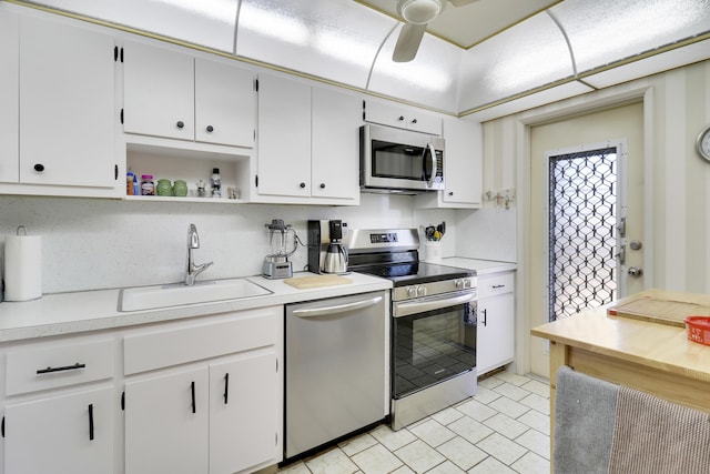 kitchen featuring white cabinets, ceiling fan, sink, and appliances with stainless steel finishes