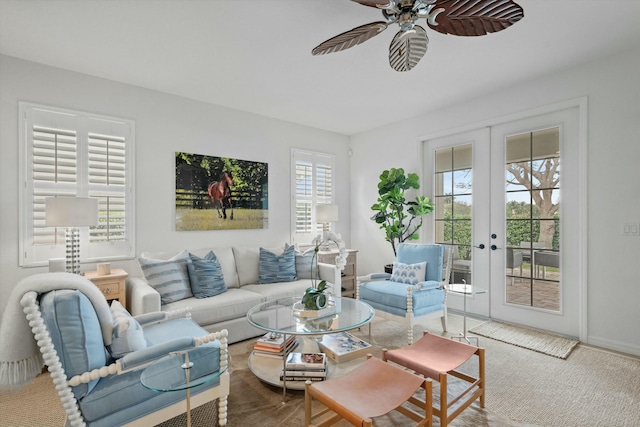 carpeted living room featuring ceiling fan and french doors