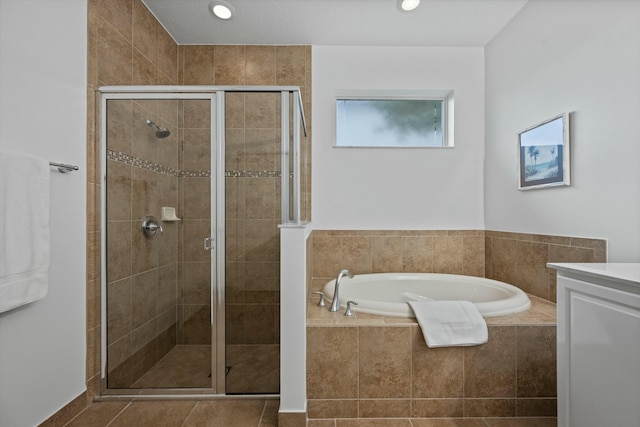 bathroom with vanity, separate shower and tub, and tile patterned flooring