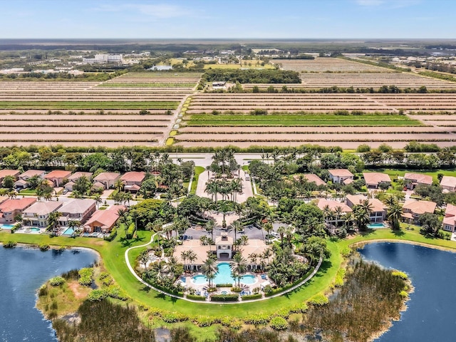 bird's eye view with a rural view and a water view