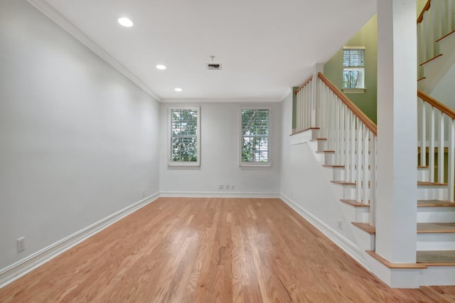 interior space featuring light hardwood / wood-style flooring and ornamental molding