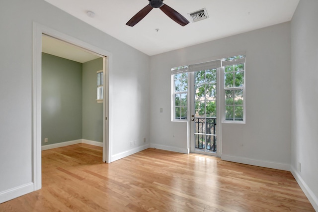 empty room featuring light hardwood / wood-style flooring and ceiling fan