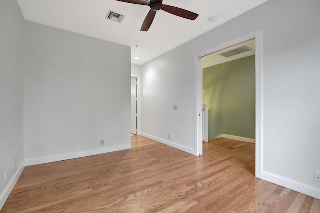 unfurnished room featuring light hardwood / wood-style flooring and ceiling fan