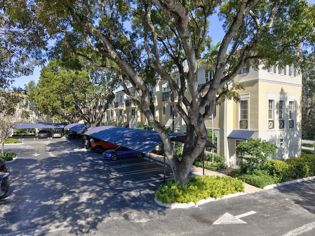 view of front of property featuring a carport