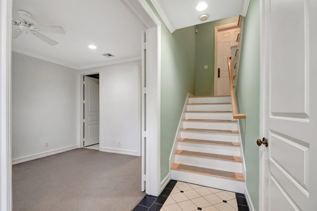 stairs with carpet flooring, crown molding, and ceiling fan