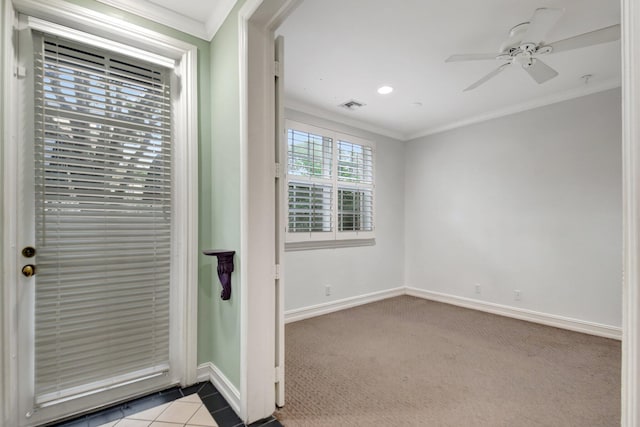 interior space with ceiling fan and crown molding