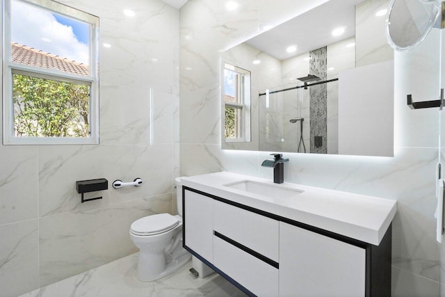 bathroom featuring plenty of natural light, vanity, an enclosed shower, and toilet