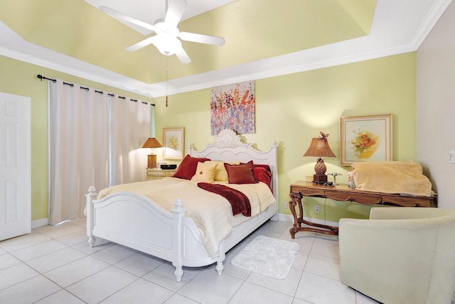 bedroom featuring baseboards, ornamental molding, light tile patterned floors, a raised ceiling, and a ceiling fan