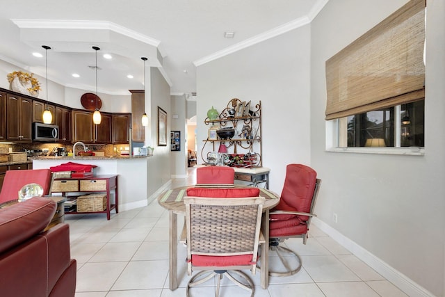 dining space featuring light tile patterned floors, recessed lighting, crown molding, and baseboards