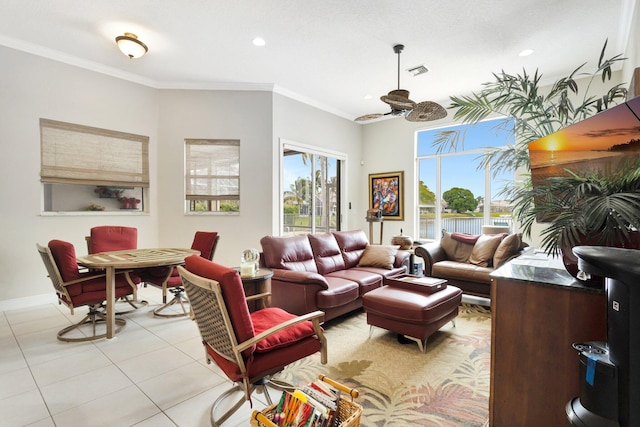 living room with light tile patterned floors, a ceiling fan, visible vents, recessed lighting, and crown molding