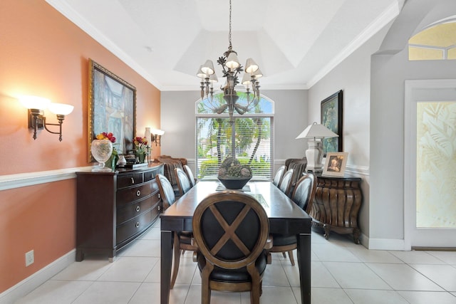 dining room with crown molding, baseboards, a tray ceiling, an inviting chandelier, and light tile patterned flooring