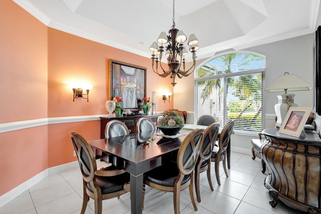 dining room featuring a tray ceiling, baseboards, ornamental molding, and a chandelier