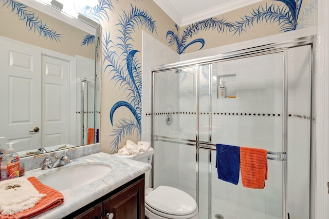 full bathroom featuring vanity, a stall shower, crown molding, and toilet