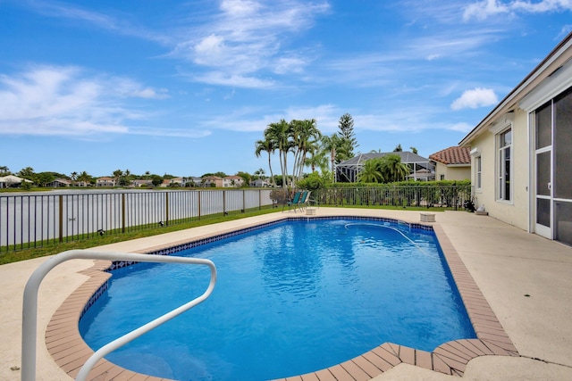 view of swimming pool featuring a patio area, a fenced in pool, a fenced backyard, and a water view