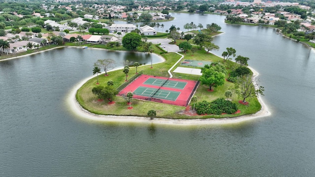 birds eye view of property with a water view and a residential view