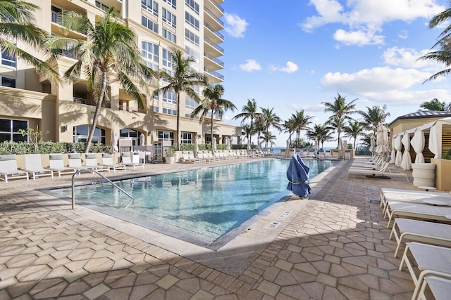 view of swimming pool with a patio area