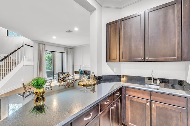 kitchen featuring dark brown cabinets