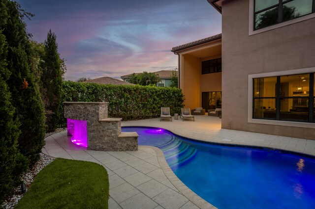 view of pool featuring a fenced in pool and a patio