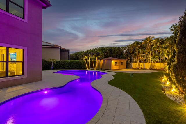 patio terrace at dusk with an outdoor pool