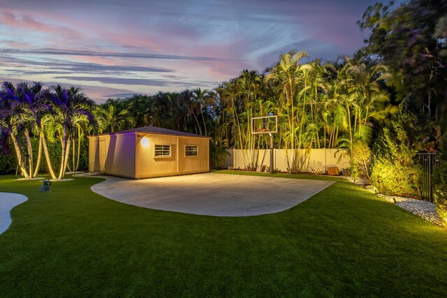 mediterranean / spanish home with a garage, decorative driveway, a tile roof, and stucco siding