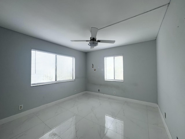 spare room featuring ceiling fan