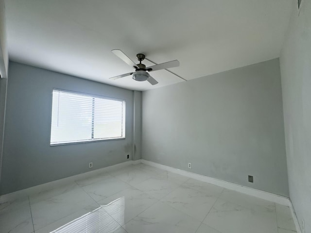 spare room with ceiling fan