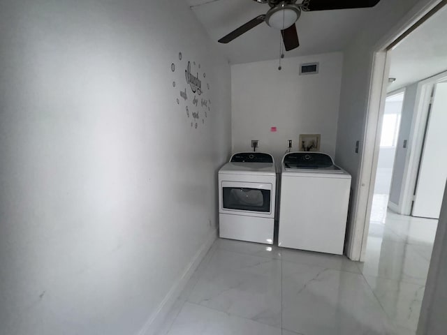 laundry room featuring washing machine and dryer and ceiling fan