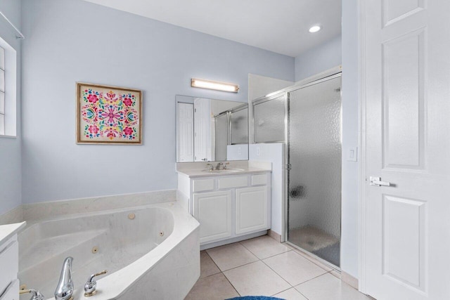 bathroom with independent shower and bath, tile patterned flooring, and vanity