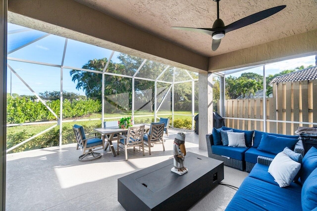 sunroom featuring ceiling fan