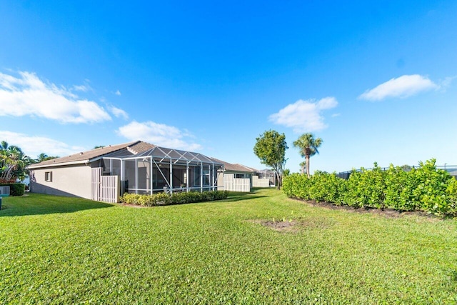 view of yard featuring glass enclosure