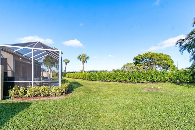 view of yard featuring a lanai