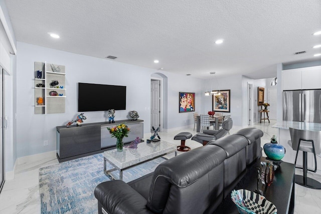 living room with a textured ceiling