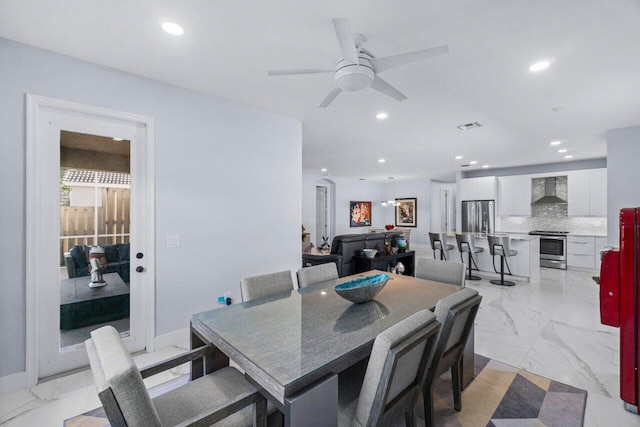 dining room featuring ceiling fan