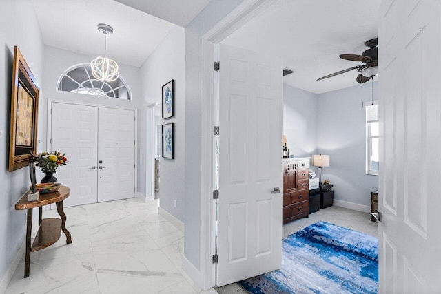 foyer featuring ceiling fan