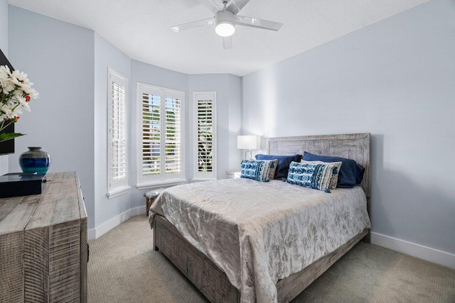 bedroom featuring ceiling fan and light colored carpet