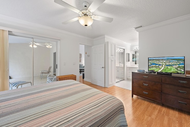 bedroom with connected bathroom, ceiling fan, crown molding, and light hardwood / wood-style flooring