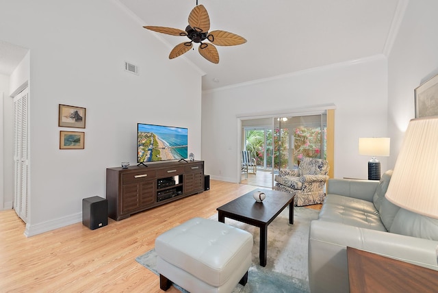 living room with crown molding, high vaulted ceiling, ceiling fan, and light hardwood / wood-style flooring