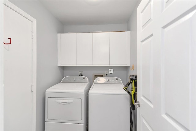 laundry area with cabinets and independent washer and dryer