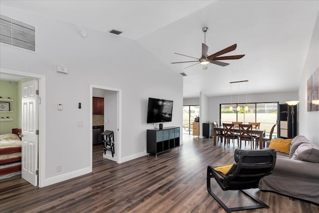 living room featuring ceiling fan, dark hardwood / wood-style floors, and high vaulted ceiling