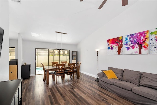 dining space with ceiling fan and dark hardwood / wood-style floors