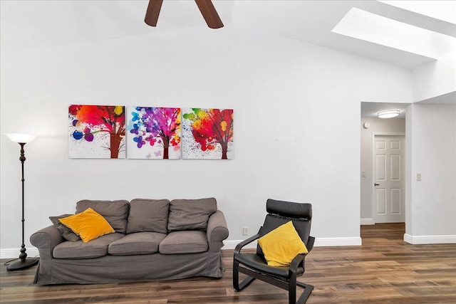 living room with ceiling fan, hardwood / wood-style floors, and high vaulted ceiling