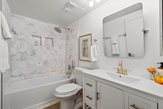 full bathroom with toilet, tiled shower / bath combo, and vanity