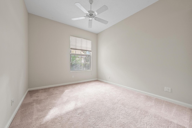 unfurnished room featuring ceiling fan and carpet flooring