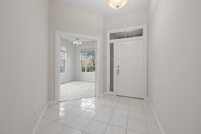 entrance foyer featuring ceiling fan and light tile patterned flooring