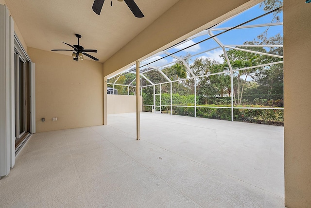 view of patio / terrace with ceiling fan and a lanai