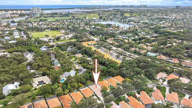 birds eye view of property featuring a water view