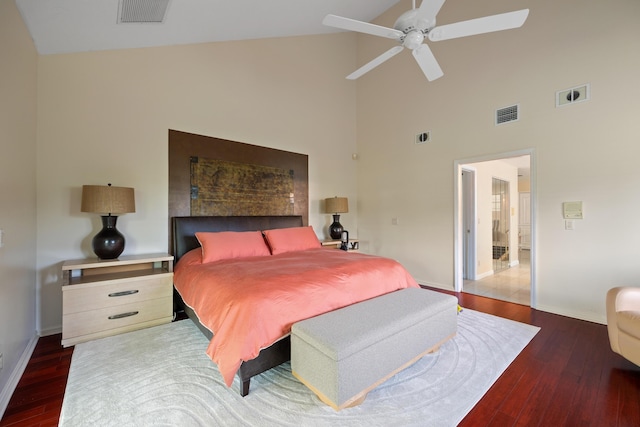 bedroom featuring dark hardwood / wood-style floors, high vaulted ceiling, and ceiling fan